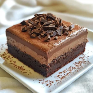 For these rich chocolate mousse brownies, gather the following: - 1 cup unsalted butter - 8 oz dark chocolate (60-70% cocoa), chopped - 1 cup granulated sugar - 1 cup brown sugar, packed - 4 large eggs - 1 teaspoon pure vanilla extract - 1 cup all-purpose flour - 1/2 cup unsweetened cocoa powder - 1/2 teaspoon salt - 1 cup heavy cream - 2 tablespoons powdered sugar - 1 teaspoon espresso powder (optional) - Chocolate shavings or cacao nibs for garnish If you can't find certain ingredients, here are some swaps: - Use coconut oil instead of butter for a dairy-free option. - Swap dark chocolate for semi-sweet chocolate if you prefer a sweeter taste. - You can replace granulated sugar with coconut sugar for a healthier choice. - Use egg substitutes like flaxseed meal or applesauce if you want a vegan version. Quality matters when making these brownies. Here are some tips: - Chocolate: Select high-quality dark chocolate. Look for brands with minimal ingredients. - Butter: Use unsalted butter for better control over salt levels. - Eggs: Fresh, organic eggs will enhance the flavor and texture. - Vanilla: Pure vanilla extract offers a richer taste than imitation. - Cocoa Powder: Choose unsweetened cocoa powder with a deep color for bold flavor. Choosing the right ingredients will elevate your chocolate mousse brownies. Enjoy the process! {{ingredient_image_2}} Start by preheating your oven to 350&deg;F (175&deg;C). This ensures even baking. Next, grab a 9x13 inch baking pan. Lightly grease it and line the bottom and sides with parchment paper. Leave some paper hanging over the edges. This will help you lift the brownies out later. In a medium saucepan, combine 1 cup of unsalted butter and 8 ounces of chopped dark chocolate. Melt them over low heat. Stir continuously until the mix is smooth. Once melted, remove it from the heat and let it cool slightly before using it. In a large bowl, mix 1 cup of granulated sugar and 1 cup of brown sugar. Pour in the slightly cooled chocolate mix. Stir well to blend the sugars fully. Then, add 4 large eggs one at a time. Mix after each addition. Finally, stir in 1 teaspoon of pure vanilla extract. In a separate bowl, sift together 1 cup of all-purpose flour, 1/2 cup of unsweetened cocoa powder, and 1/2 teaspoon of salt. Slowly fold the dry ingredients into the wet mix. Be gentle; we don&rsquo;t want to overmix. Now, pour the batter into your prepared pan. Spread it evenly. Bake for 25-30 minutes. Check with a toothpick. It should come out with a few moist crumbs. While the brownies bake, whip up the chocolate mousse. In a mixing bowl, beat 1 cup of heavy cream, 2 tablespoons of powdered sugar, and 1 teaspoon of espresso powder (if using). Whip until soft peaks form. Be careful not to overwhip; the mousse should be fluffy and smooth. Once the brownies cool completely, lift them out using the parchment overhang. Spread the whipped mousse evenly on top of the brownies. Chill in the fridge for at least 1 hour. This helps the mousse set. Just before serving, sprinkle with chocolate shavings or cacao nibs for a fancy touch. Cut into squares, serve, and enjoy! For the best brownie texture, start with quality chocolate. I use dark chocolate with 60-70% cocoa for rich flavor. Melt the chocolate and butter slowly. Stir often to keep it smooth. Mix the sugar and chocolate well before adding eggs. This step helps create a shiny crust. When you mix in the flour, do it gently. Overmixing can lead to dry brownies. Bake them until a toothpick shows moist crumbs. This means they are perfectly fudgy. To make light and fluffy mousse, use heavy cream. It whips up better than lighter creams. Add powdered sugar for sweetness and espresso powder for depth. Whip the cream until soft peaks form. Stop mixing once it becomes fluffy. Overwhipping can lead to grainy mousse. Spread it evenly on cooled brownies. Chilling helps the mousse set and gives it a nice texture. Many people overbake brownies, making them dry. Always check with a toothpick. If it comes out with a few moist crumbs, they are done. Another mistake is not letting brownies cool. They need to cool completely before adding mousse. This prevents melting and helps keep layers distinct. Finally, don&rsquo;t rush the chilling step. Letting the mousse set is key to a great dessert. Pro Tips Use Quality Chocolate: The flavor of your brownies will largely depend on the quality of the chocolate you use. Opt for a high-quality dark chocolate with at least 60% cocoa for a rich and decadent taste. Don&rsquo;t Overmix: When combining the dry ingredients with the wet ingredients, mix just until combined. Overmixing can lead to tough brownies instead of the desired fudgy texture. Let Them Cool: It's crucial to let the brownies cool completely before adding the mousse. This prevents the mousse from melting and ensures a clean, beautiful layer on top. Chill Before Serving: Allow the assembled brownies to chill in the fridge for at least an hour. This helps the mousse set properly, making for easier slicing and a more enjoyable texture. {{image_4}} You can jazz up your chocolate mousse brownies with extra flavors. One easy way is to add mint. Use mint extract in the mousse for a refreshing twist. A little goes a long way, so start with just a half teaspoon. Another fun option is orange. Add orange zest to the brownie mix for a bright flavor. You can also use orange extract in the mousse. This adds a citrus kick that pairs well with chocolate. You can easily make these brownies gluten-free. Swap the all-purpose flour for a gluten-free blend. Look for a blend that has xanthan gum to help with texture. This keeps your brownies moist and chewy. Make sure your chocolate is also gluten-free. Most dark chocolates are safe, but check the label. You want to avoid any hidden gluten. Serve these brownies with some fresh berries. Raspberries or strawberries add a nice tartness. A scoop of vanilla ice cream goes great with the rich chocolate too. For a fun twist, pair the brownies with a strong coffee. The coffee brings out the chocolate flavor. You can even sprinkle some sea salt on top for a salty-sweet treat. To keep your chocolate mousse brownies fresh, store them in an airtight container. This method prevents air from drying them out. Always let the brownies cool completely before storing. If they are warm, they can create steam, which makes them soggy. You can keep them at room temperature for up to three days. If you want them to last longer, refrigerate them for up to a week. Mousse can lose its lightness if not stored right. To preserve that fluffy texture, cover the mousse brownies with plastic wrap. Ensure the wrap doesn&rsquo;t touch the mousse. This keeps moisture out and helps maintain its creaminess. When ready to serve, simply remove the wrap and cut the brownies. The mousse will still be smooth and delicious. Freezing is a great way to save extras. First, cut the brownies into squares. This makes it easier to thaw only what you need. Wrap each square in plastic wrap, then place them in a freezer-safe bag. They can stay frozen for up to three months. When you&rsquo;re ready to enjoy them, let them thaw in the fridge overnight. This keeps the mousse from melting too fast. Enjoy the rich taste of these brownies anytime! To cut brownies cleanly, use a sharp knife. First, let the brownies cool fully. Run the knife under hot water, then dry it. Make your cuts in straight, even strokes. Wipe the knife between cuts to keep it clean. This keeps the edges neat and reduces crumbling. Yes, you can make the mousse ahead of time. Prepare it one day before you plan to serve the brownies. Store it in the fridge in an airtight container. Just remember to spread it on the brownies right before serving. To prevent sticking, grease your pan well. Use unsalted butter or cooking spray. Line the bottom and sides with parchment paper, leaving overhang. This helps you lift the brownies out easily after baking. For this recipe, use dark chocolate with 60-70% cocoa. This gives a rich flavor. You can also use semi-sweet chocolate if you prefer a sweeter taste. Avoid using milk chocolate, as it may make the brownies too sweet. Chocolate mousse brownies last about 3-4 days in the fridge. Store them in an airtight container to keep them fresh. If you want to keep them longer, you can freeze them for up to 2 months. Just wrap them well in plastic wrap. You learned how to make chocolate mousse brownies, from ingredients to storage. Quality ingredients lead to great desserts. Follow the steps for perfect brownies and fluffy mousse. Don't skip the tips to avoid common mistakes. You can try different flavors and even make a gluten-free version. Store wisely to keep your treats fresh longer. Enjoy the process, and impress your friends with this delicious dessert!