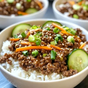 - 1 pound ground beef (85% lean) - 1 tablespoon sesame oil - 4 cloves garlic, finely minced - 1-inch piece of fresh ginger, finely grated - 3 tablespoons low-sodium soy sauce - 2 tablespoons brown sugar - 1 tablespoon rice vinegar - 1 tablespoon gochujang (Korean chili paste) - 1 cup green onions, chopped (keeping the white and green parts separate) - 2 cups cooked jasmine rice - 1 cup shredded carrots - 1 cup cucumber, thinly sliced - 1 tablespoon sesame seeds (for garnish) - Optional: Kimchi, for serving When making Korean Ground Beef Bowls, the right ingredients matter. Start with ground beef that is 85% lean. This keeps the dish juicy. I like to use sesame oil for cooking. It adds a nutty flavor. Fresh garlic and ginger give a nice aroma and depth. For the sauce, low-sodium soy sauce helps control saltiness. Brown sugar adds sweetness. Rice vinegar gives a tangy kick, while gochujang brings heat. Adjust the gochujang to your spice level. When serving, I chop green onions, keeping the white and green parts separate. Cooked jasmine rice makes a great base. Shredded carrots add color and crunch. Thinly sliced cucumbers cool down the dish. Finally, sprinkle sesame seeds for texture. If you want, add kimchi for an extra burst of flavor. These ingredients work together to create a satisfying meal you will love. {{ingredient_image_2}} - Heat sesame oil in a skillet over medium-high heat. - Saut&eacute; minced garlic and grated ginger for 1 minute. Start by warming the sesame oil in your skillet. The oil adds a rich flavor to the dish. After the oil gets hot, toss in the minced garlic and grated ginger. Keep an eye on it! You want them to turn fragrant, not burnt. - Add ground beef and brown for 5-7 minutes until fully cooked. - Prepare sauce: whisk soy sauce, brown sugar, rice vinegar, and gochujang. Next, add the ground beef to the skillet. Use a spatula to break the meat apart. Cook it for about 5 to 7 minutes. You want it nicely browned and fully cooked. While the beef cooks, grab another bowl. In this bowl, whisk together soy sauce, brown sugar, rice vinegar, and gochujang. It should turn into a smooth mixture. - Pour sauce over cooked beef, simmer for 2-3 minutes. - Add white parts of green onions and shredded carrots, cook for 2 minutes. Once the beef is ready, pour the sauce over it. Stir well to coat the meat. Let it simmer for 2 to 3 minutes. This helps the flavors mix together. Now, add the white parts of the green onions and the shredded carrots. Cook everything together for 2 more minutes. The carrots should soften just a bit. - Place jasmine rice as the base in each bowl. - Top with Korean ground beef, cucumbers, and remaining green onions. - Garnish with sesame seeds and optional kimchi. Now, it's time to build your bowls! Start with a scoop of jasmine rice at the bottom. This serves as the base. Next, spoon the Korean ground beef mixture on top of the rice. Add some thinly sliced cucumbers for crunch. Finally, sprinkle the green parts of the green onions on top. For a finishing touch, add sesame seeds. If you like, serve with kimchi on the side for extra flavor. Enjoy your delicious Korean Ground Beef Bowls! - Use an 85% lean beef for best flavor and texture. This ratio keeps the meat juicy. - Adjust gochujang to suit your spice preference. Start with a small amount if unsure. - Serve with a side of kimchi for color and flavor contrast. It adds zest to your dish. - Sprinkle additional sesame seeds on top for extra crunch. They also make the dish look nice. - Add sesame oil to the serving bowl for extra richness. It deepens the flavor of the meal. - Experiment with pickled vegetables for added depth. They provide a nice tang and crunch. Pro Tips Adjust Spice Level: Depending on your spice tolerance, you can increase or decrease the amount of gochujang used in the recipe. Start with a smaller amount and taste as you go to find your perfect balance. Use Fresh Ingredients: For the best flavor, opt for fresh garlic and ginger. This will enhance the overall taste of your Korean ground beef bowls, making them more aromatic and delicious. Customize Your Toppings: Feel free to add other toppings such as avocado, radishes, or pickled vegetables to your bowls for a personalized touch and extra texture. Meal Prep Friendly: This dish is great for meal prep! Cook a larger batch of the ground beef mixture and store it in the fridge for up to 3 days, making it easy to assemble quick meals during the week. {{image_4}} You can easily change this dish to fit your needs. For a leaner option, use ground turkey or chicken instead of beef. This will give you less fat while keeping the flavor. If you want a low-carb meal, try cauliflower rice instead of jasmine rice. It has a nice texture and soaks up the sauce well. Feel free to get creative with your ingredients! Adding extra veggies can make your bowl even better. You can mix in bell peppers or snap peas for extra crunch and color. If you want to switch up the flavors, try using different sauces like teriyaki or sweet chili. Each sauce will give your dish a unique twist. For a more authentic taste, consider using marinated beef bulgogi instead of ground beef. This will give your meal a richer flavor that is hard to beat. You can also serve your bowls with traditional Korean side dishes. A cucumber salad pairs well and adds a refreshing crunch. - Store cooked Korean ground beef in an airtight container. - Keep jasmine rice stored separately to prevent sogginess. This helps keep your rice fluffy and fresh. - Leftovers can last in the refrigerator for up to 3-4 days. - Make sure to reheat thoroughly before serving. This ensures you enjoy the full flavor and safety. - Freeze portions in airtight containers for up to 3 months. This is great for meal prep. - Thaw in the refrigerator before reheating. This method keeps the meat juicy and tasty. You can use sriracha or chili garlic sauce as alternatives. Both have a nice kick. If you like it less spicy, go easy on the amount. Yes, you can! Cook the beef and rice separately. Just mix them together right before serving. This keeps everything fresh and tasty. The spiciness depends on how much gochujang you use. Start with a little, then taste it. You can add more if you want more heat. You can swap ground beef with saut&eacute;ed mushrooms or tofu. Both options work well and keep the dish filling. Enjoy the flavors without the meat! This recipe for Korean ground beef offers delicious flavors and easy steps. You start with cooking the beef and preparing a tasty sauce. Then, you assemble your bowl with rice and fresh toppings. Remember, you can adjust spice levels and try different proteins or veggies. In the end, this dish is adaptable and perfect for any meal. Enjoy making it your own while savoring every bite!