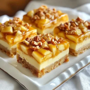 - 1 &frac12; cups graham cracker crumbs - &frac12; cup unsalted butter, melted - 2 tablespoons brown sugar - 16 oz cream cheese, softened at room temperature - 1 cup granulated sugar - 2 large eggs - 1 teaspoon pure vanilla extract - 1 teaspoon ground cinnamon - 2 cups apples, peeled and diced (about 2 medium apples) - &frac12; cup caramel sauce (plus extra for drizzling) - &frac12; cup chopped nuts (optional; use pecans or walnuts) These ingredients work together to create a sweet and creamy treat. The graham cracker crumbs form a crunchy base. Unsalted butter helps bind the crust. Brown sugar adds a hint of caramel flavor. Cream cheese makes the filling rich and creamy. Granulated sugar sweetens it up. Eggs give the bars structure. Vanilla extract adds warmth, while ground cinnamon gives a nice spice. For the apple element, pick your favorites. I enjoy using tart apples for a nice contrast. The caramel sauce brings everything together. If you love nuts, sprinkle some on top for crunch. Each ingredient matters in making these bars a hit! {{ingredient_image_2}} 1. Preheat the oven and prepare the baking dish: Start by preheating your oven to 350&deg;F (175&deg;C). Take an 8x8-inch baking dish and line it with parchment paper. Make sure the edges hang over the sides. This helps with easy removal later. 2. Make the graham cracker crust: In a medium bowl, mix 1 &frac12; cups of graham cracker crumbs, &frac12; cup of melted unsalted butter, and 2 tablespoons of brown sugar. Stir until it feels like wet sand. Press this mixture firmly into the bottom of the baking dish. This crust will hold all the yummy filling. 3. Bake the crust and prepare the filling: Bake the crust in the oven for 8 minutes. Once done, take it out and let it cool while you make the cheesecake filling. 1. Beat the cream cheese and incorporate sugars: In a large bowl, beat 16 oz of softened cream cheese with an electric mixer for about 2-3 minutes. Add in 1 cup of granulated sugar, mixing until fluffy and fully combined. 2. Add eggs, vanilla, and cinnamon: Now, add 2 large eggs one by one. Mix slowly after each egg. Then, add 1 teaspoon of pure vanilla extract and 1 teaspoon of ground cinnamon. Make sure everything is mixed well. 3. Fold in apples and caramel, pour over crust: Gently fold in 2 cups of peeled and diced apples and &frac12; cup of caramel sauce. Be careful not to overmix. Pour this yummy filling over the cooled graham cracker crust. For some crunch, you can sprinkle &frac12; cup of chopped nuts on top if you like. 1. Bake and check for doneness: Place the dish back in the oven and bake for 30-35 minutes. The edges should set, but the center can still jiggle a bit. It will firm up as it cools. 2. Cool to room temperature, then chill: After baking, let the cheesecake bars cool in the dish until they reach room temperature. Then, transfer them to the refrigerator. Chill for at least 2 hours before serving. These steps will guide you to create the perfect caramel apple cheesecake bars that taste like fall! - Ensuring smooth cream cheese mixture: Start with cream cheese at room temperature. This helps it blend easily. Use an electric mixer for 2-3 minutes until smooth. Scrape down the sides to mix well. - Tips for folding in apples: After mixing the filling, add the apples gently. Use a spatula to fold them in. Don&rsquo;t stir too hard; you want to keep the apples intact for nice bites. - How to achieve the perfect bake: Bake at 350&deg;F (175&deg;C) for 30-35 minutes. The edges should look set. The center will jiggle slightly. It firms up as it cools. - Presentation ideas for serving: Place the cheesecake bars on a pretty platter. Drizzle with extra caramel sauce. Sprinkle crushed nuts on top for texture. Add thin apple slices around the edges for color. - Ideal pairings with beverages: These bars pair well with warm cider or pumpkin spice latte. A cup of coffee also complements them nicely. - Suggested garnishes for added flavor: Top each bar with whipped cream. A sprinkle of ground cinnamon adds warmth. You can also add a pinch of sea salt for a sweet-salty twist. Pro Tips Use Room Temperature Ingredients: Make sure your cream cheese is softened to room temperature for easier blending, resulting in a smooth and creamy filling. Choose the Right Apples: Opt for tart apples like Granny Smith or Honeycrisp for a balance of flavors that complement the sweetness of the caramel. Don&rsquo;t Overmix: When folding in the apples and caramel, be gentle to avoid breaking up the apple pieces and maintain a pleasing texture. Chill Before Serving: Allow the cheesecake bars to chill completely for at least 2 hours; this helps the flavors meld and makes them easier to cut into clean squares. {{image_4}} You can mix up the flavor of your caramel apple cheesecake bars by adding different fruits. Try pears or peaches for a sweet twist. Each fruit brings its own flavor and texture. Apples are great, but exploring other options can surprise your taste buds. You can also change the nuts you use. Instead of pecans or walnuts, consider almonds or macadamia nuts. Each nut offers a unique crunch and flavor. This small change can make a big difference in your dessert. If you need a gluten-free option, look for gluten-free graham crackers. Many brands offer tasty alternatives. You can enjoy the same crust flavor without gluten. For a dairy-free version, use a cream cheese substitute. There are great non-dairy cream cheeses made from nuts or soy. These options keep the creamy texture while catering to dietary needs. To keep your caramel apple cheesecake bars fresh, store them in the refrigerator. - Use an airtight container: Place the bars in a container with a tight lid. This keeps them moist and prevents them from absorbing other smells. - Layer with parchment paper: If stacking, use parchment paper between layers. This prevents sticking and makes it easy to serve. For longer storage, you can freeze the bars. - Wrap tightly: Use plastic wrap or aluminum foil to cover the bars completely. - Store in a freezer-safe container: This helps prevent freezer burn. - Label with the date: This way, you know when to use them by. If you freeze your cheesecake bars, thaw them before eating. - Thaw in the fridge: Place the bars in the fridge overnight for a slow thaw. This keeps them from getting too mushy. - Quick thaw method: If you need them fast, leave them at room temperature for about 2 hours. To reheat, use one of these methods: - Microwave: Heat on low power for about 10-15 seconds. Check often to avoid overheating. - Oven: Preheat your oven to 300&deg;F (150&deg;C). Heat the bars for about 10-15 minutes. This will help keep the crust crisp. Now, your caramel apple cheesecake bars will be ready to enjoy anytime! I recommend using tart apples like Granny Smith. Their tangy flavor balances the sweet caramel. Honeycrisp apples also work well for a crisp texture. You want apples that hold their shape during baking. Yes, you can! These bars store well. Make them a day or two before your event. Just keep them in the fridge. Allowing them to chill helps the flavors meld beautifully. To adjust sweetness, you can cut back on the granulated sugar. You might also add less caramel sauce. Taste the filling before baking to find your perfect level of sweetness. Absolutely! You can use applesauce or a flaxseed mixture as an egg substitute. Mix one tablespoon of ground flaxseed with three tablespoons of water. Let it sit for a few minutes until it thickens. This makes for a great binding agent. This article covers a delicious cheesecake bar recipe from start to finish. You learned about key ingredients, preparation steps, and baking techniques to create a tasty treat. I shared helpful tips for baking and serving, along with variations and storage advice. Keep these ideas in mind as you bake. With a few simple steps and ingredients, you&rsquo;ll impress everyone with your cheesecake bars. Enjoy making this dessert, and feel free to experiment with flavors!