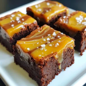 To make these salted caramel brownie bites, gather the following main ingredients: - 1 cup unsalted butter - 1 cup dark chocolate chips - 2 cups granulated sugar - 4 large eggs - 1 teaspoon vanilla extract - 1 cup all-purpose flour - 1/2 cup cocoa powder - 1 teaspoon baking powder - 1/2 teaspoon salt - 1 cup salted caramel sauce - Sea salt flakes for topping These ingredients come together to create a rich, fudgy base. The chocolate chips and cocoa powder give a deep flavor. The salted caramel adds sweetness and a nice contrast to the brownies. You will need some tools to make this recipe easy: - Medium saucepan - Large mixing bowl - Whisk - Spatula - 9x13 inch baking pan - Parchment paper - Knife or skewer - Wire rack for cooling These tools help mix, bake, and serve your brownie bites perfectly. Using parchment paper makes it easier to lift the brownies out later. You can add some fun toppings to make these bites even better: - Extra salted caramel sauce for drizzling - Chopped nuts like pecans or walnuts - Mini chocolate chips - Fresh fruit like raspberries or strawberries These garnishes add texture and flavor. Feel free to get creative! They can make your brownie bites look even more tempting. {{ingredient_image_2}} First, you need to preheat your oven to 350&deg;F (175&deg;C). This step is key for even baking. Next, prepare a 9x13 inch baking pan by lining it with parchment paper. Let the edges hang over the sides to help with easy removal later. In a medium saucepan, combine 1 cup of unsalted butter and 1 cup of dark chocolate chips. Place this over low heat. Stir continuously until it all melts smoothly. Once melted, take it off the heat and let it cool for a few minutes. Grab a large mixing bowl. Whisk together 2 cups of granulated sugar, 4 large eggs, and 1 teaspoon of vanilla extract. Keep whisking until the mixture is well combined and slightly frothy. In a separate bowl, sift 1 cup of all-purpose flour, 1/2 cup of cocoa powder, 1 teaspoon of baking powder, and 1/2 teaspoon of salt. This helps to mix everything evenly and keeps the brownies light. Pour half of the brownie batter into the lined baking pan. Spread it evenly. Drizzle half of the salted caramel sauce over this layer. Then, carefully spread the remaining brownie batter on top. Take a knife or skewer and gently swirl the remaining salted caramel sauce into the brownie batter. This creates a marbled effect that looks beautiful and tastes amazing. Place your pan in the preheated oven and bake for 25-30 minutes. To check if they&rsquo;re done, insert a toothpick into the center. It should come out with a few moist crumbs. After baking, remove the brownies from the oven and cool them in the pan on a wire rack. Once cool, lift them out using the parchment paper and cut into bite-sized squares. Enjoy! To make the best brownies, follow these tips: - Use high-quality dark chocolate chips. They give rich flavor. - Melt the butter and chocolate slowly. This keeps the mix smooth. - Whisk the eggs well with sugar until frothy. This adds air. - Do not overmix the batter. Mix just until blended. - Let the brownies cool fully before cutting. This helps them hold shape. Many people make a few common mistakes. Here&rsquo;s how to avoid them: - Don&rsquo;t skip the parchment paper. It helps with easy removal. - Avoid opening the oven too soon. This can cause brownies to sink. - Don&rsquo;t bake too long. Check for moist crumbs with a toothpick. - Avoid using cold ingredients. Bring eggs and butter to room temp. - Don&rsquo;t neglect the cooling time. Cutting warm brownies can make a mess. Creating beautiful caramel swirls involves some tricks: - Use a thin caramel sauce for easy drizzling. It spreads well. - Don&rsquo;t swirl too much. You want defined layers, not mixed colors. - Use a knife or skewer for swirling. A gentle hand works best. - Add a pinch of sea salt on top after baking. It enhances flavor. - Drizzle more caramel right before serving. This adds a nice touch. Pro Tips Use High-Quality Chocolate: The flavor of your brownies will greatly depend on the quality of the chocolate you use. Opt for a good quality dark chocolate for the best taste. Don't Overmix: When combining the dry ingredients with the wet mixture, mix just until incorporated. Overmixing can lead to dense brownies. Check for Doneness: To ensure perfectly fudgy brownies, check them a few minutes before the end of the baking time. They should have a few moist crumbs on the toothpick. Cool Completely: Let the brownies cool completely in the pan before cutting. This helps them set and makes cutting easier without crumbling. {{image_4}} You can add nuts for extra crunch. I love walnuts or pecans. Chopping them into small pieces works best. Mix about 1 cup of nuts into the batter. This way, every bite has a delightful nutty flavor. You can also sprinkle some chopped nuts on top before baking. This adds a nice touch and makes them look great. Want a gluten-free treat? Swap the all-purpose flour with a gluten-free blend. Many brands are available, and they work well in this recipe. Just ensure the blend has a good mix of flour types. This change still gives you that rich brownie taste without gluten. Everyone can enjoy these bites! You can easily change the flavor of your brownie bites. For a coffee kick, add 1 tablespoon of espresso powder to the wet mix. This gives a rich depth to the chocolate. If you prefer a minty twist, add a few drops of peppermint extract. This makes the brownies fresh and fun! You can also use orange zest for a citrusy vibe. The possibilities are endless, so feel free to experiment! To keep your brownie bites fresh, store them in an airtight container. Place parchment paper between layers to prevent sticking. They will stay good for up to four days at room temperature. If you want them to last longer, refrigerate them. Keep in mind that chilling may change the texture slightly. You can freeze brownie bites for up to three months. First, let them cool completely. Then, wrap each bite in plastic wrap. Place them in a freezer bag or container. Remember to label the bag with the date. This makes it easy to grab a treat later! To reheat, take the brownie bites out of the fridge or freezer. For frozen bites, let them thaw in the fridge overnight. For a warm treat, place them in the microwave for about 10-15 seconds. This will make them soft and gooey again. Enjoy your salted caramel brownie bites warm! Yes, you can use boxed brownies. They save time and still taste great. Just follow the box instructions. Once baked, add the salted caramel sauce and sea salt on top. This makes for a quick and easy treat without much fuss. To make homemade salted caramel sauce, gather these simple ingredients: - 1 cup granulated sugar - 6 tablespoons unsalted butter - 1/2 cup heavy cream - 1 teaspoon sea salt 1. In a medium saucepan, heat the sugar over medium heat. Stir until it melts and turns a golden brown. 2. Add in the butter and mix well until melted. 3. Slowly pour in the cream, mixing until smooth. 4. Remove from heat and stir in the sea salt. This sauce is rich and perfect for your brownie bites. The best toppings for brownie bites include: - Extra salted caramel sauce - Chopped nuts like walnuts or pecans - Mini chocolate chips - Sea salt flakes These toppings add texture and flavor. You can mix and match to find your favorite combination. Salted caramel brownie bites last for about 3 to 5 days when stored properly. Keep them in an airtight container at room temperature. If you want them to last longer, you can freeze them. Just make sure to wrap them well to avoid freezer burn. You learned how to make salted caramel brownie bites. We covered key ingredients and tools you need. Step-by-step instructions guide you through each part of the process. Helpful tips help you avoid common mistakes. We also explored fun variations and storage tips for your bites. Remember, baking is about joy and creativity. Use this guide to create tasty treats that impress everyone. Happy baking!